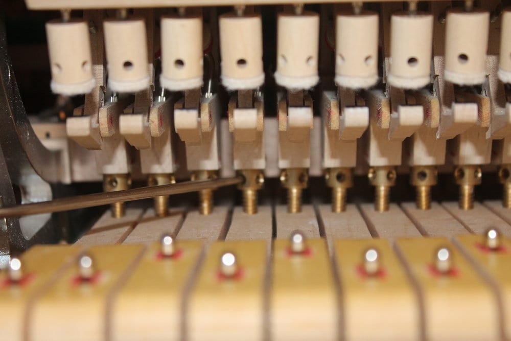  Adjusting the heigh of the hammers. The distance of the hammer to the string at rest is a critical measurement that can make or break a regulation. 